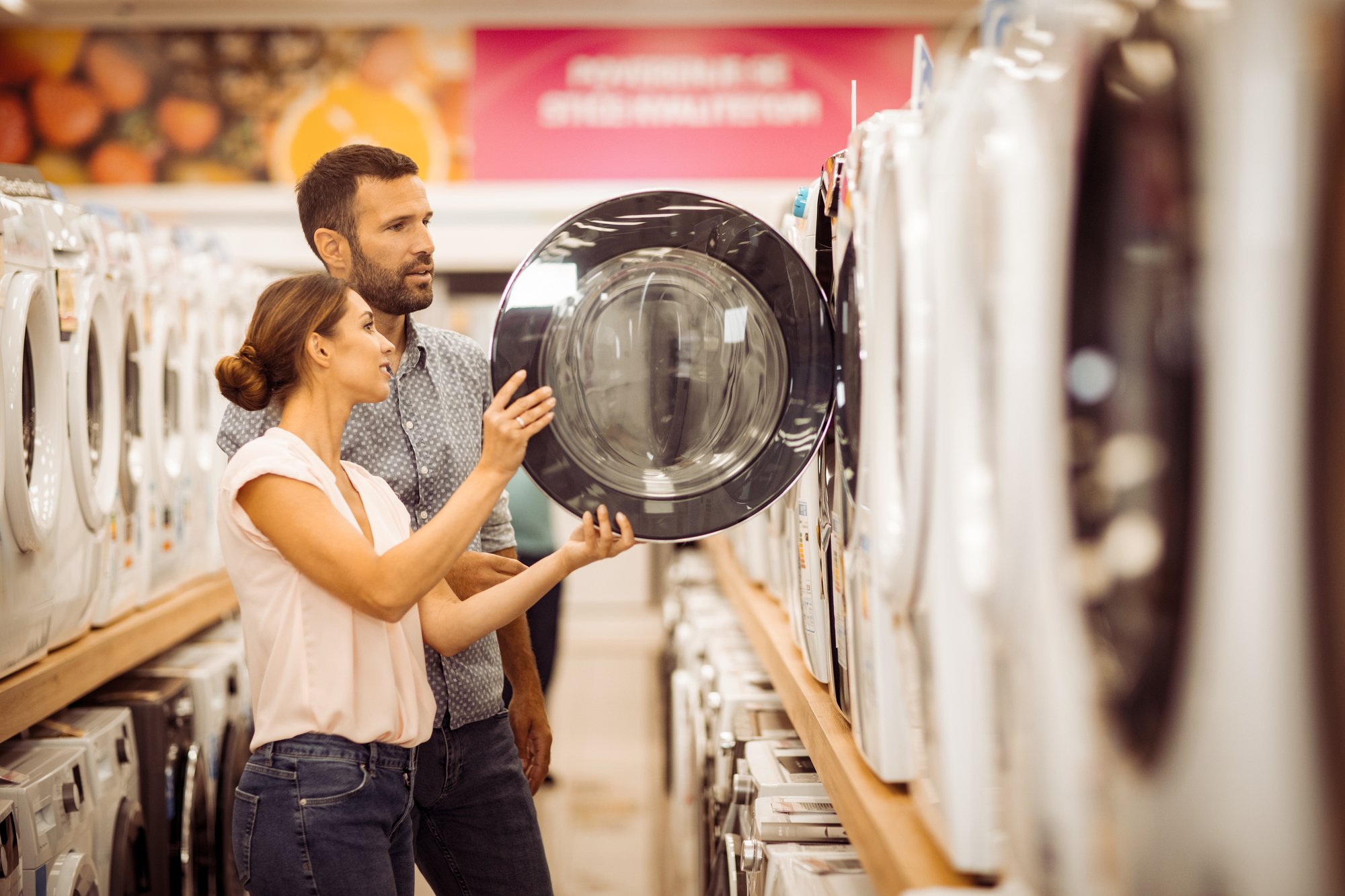 couple buying washing machines