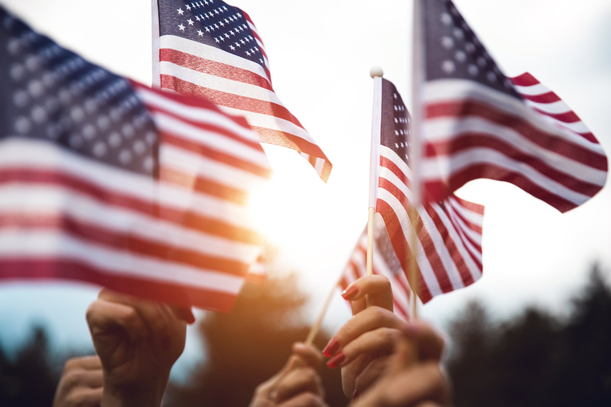 hands holding american flags (1)